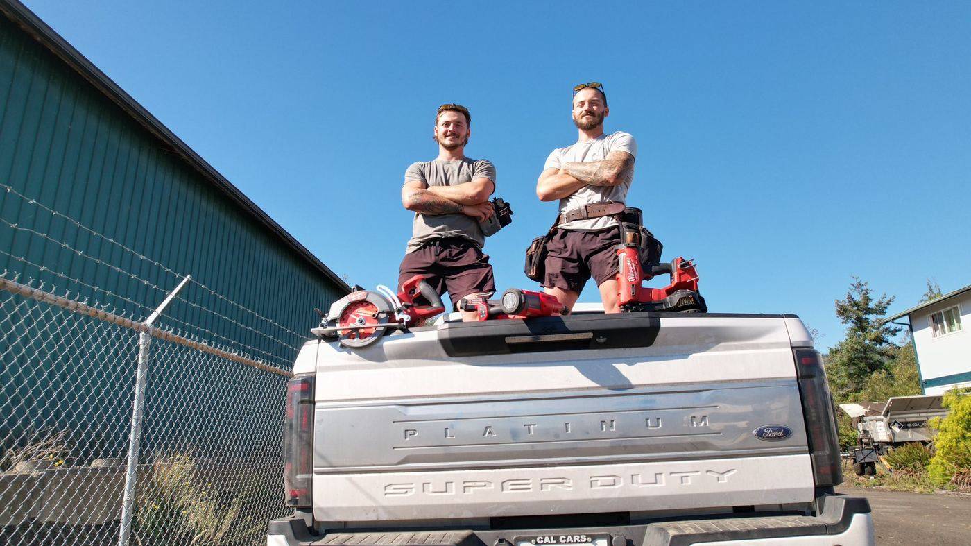 Sean and Drake Wilson, owners of Rocky Mountain Home Services, on their work truck