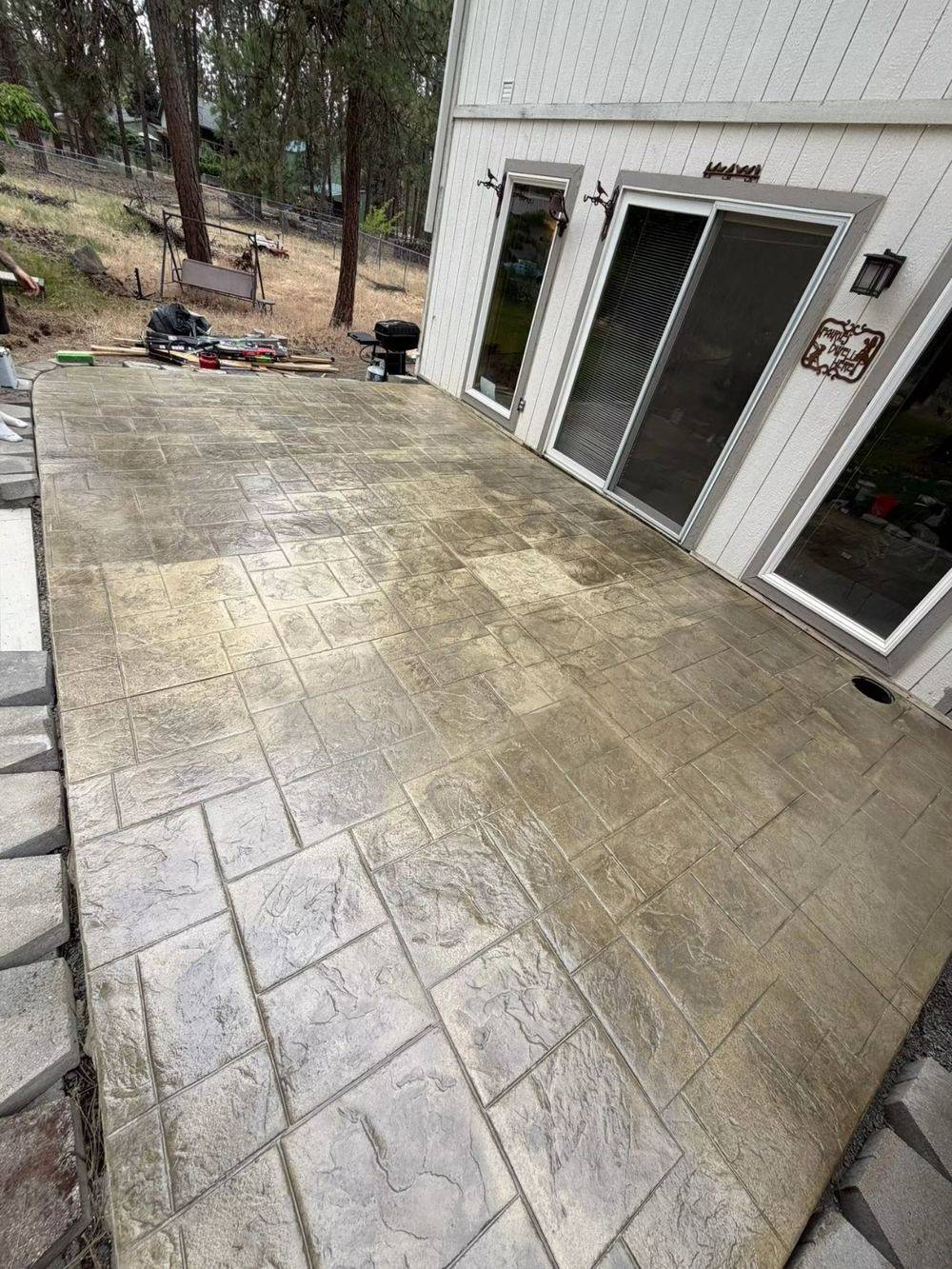 Stamped and stained concrete patio poured by Rocky Mountain Home Services