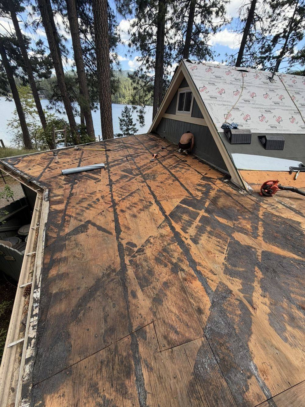 Roof torn off to bare wood decking, ready for inspection and new underlayment