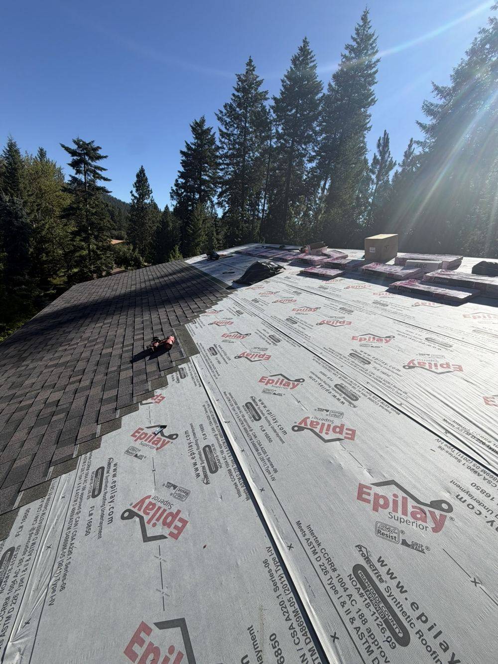 Synthetic underlayment and ice-and-water shield installed before shingles